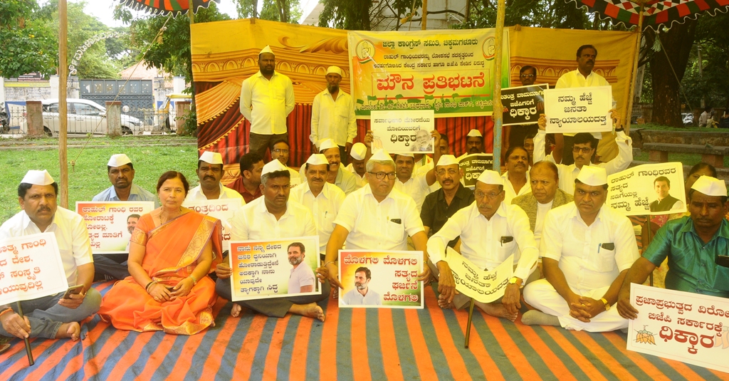 Congress workers staged a silent protest in front of the Mahatma Gandhi statue in the city